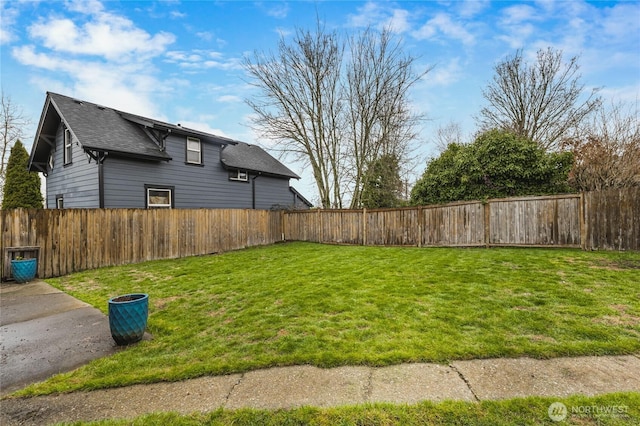 view of yard featuring a fenced backyard