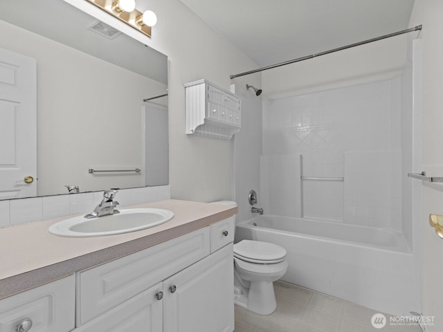 bathroom featuring visible vents, toilet, vanity, and shower / bathing tub combination