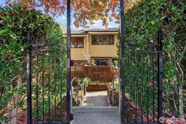 view of gate featuring fence