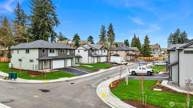 view of street with curbs, a residential view, and sidewalks