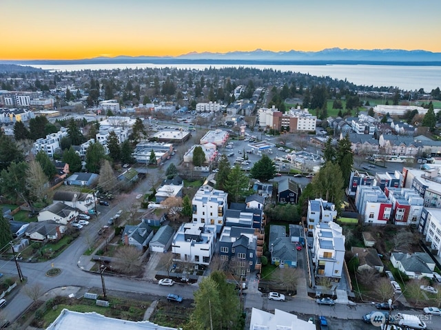 aerial view at dusk featuring a mountain view