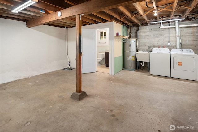 unfinished below grade area with a sink, separate washer and dryer, and secured water heater