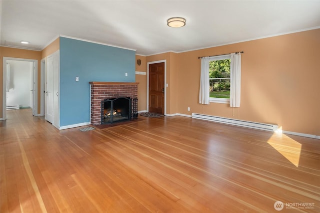 unfurnished living room with baseboards, a baseboard radiator, wood finished floors, crown molding, and a fireplace