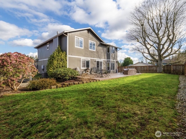 back of property featuring a patio area, central air condition unit, a lawn, and fence