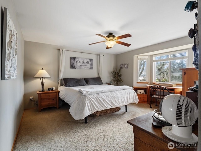 bedroom featuring light carpet and ceiling fan