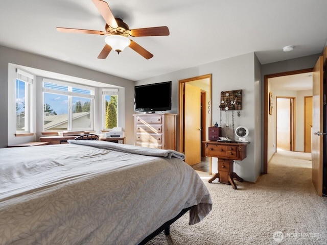 bedroom featuring light carpet and ceiling fan