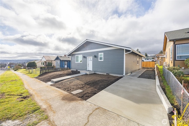 view of front of house featuring fence