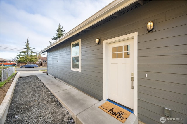 property entrance with fence