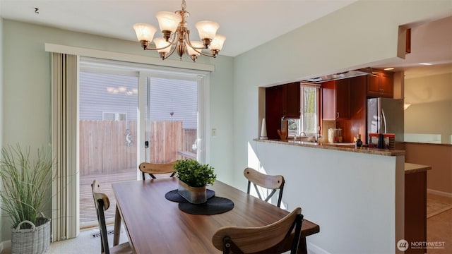 dining space with a notable chandelier