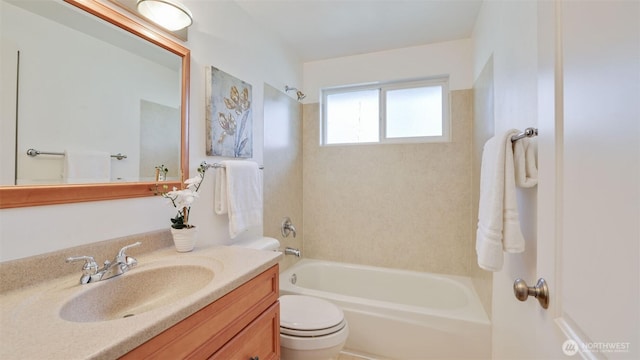 full bath featuring shower / bathtub combination, vanity, and toilet