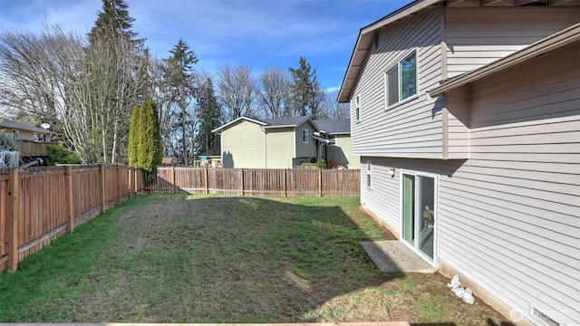 view of yard featuring a fenced backyard