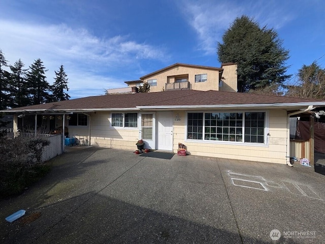 view of front of house featuring a shingled roof