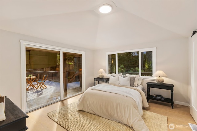 bedroom featuring high vaulted ceiling, access to outside, baseboards, and wood finished floors