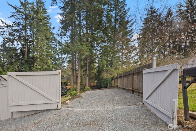 exterior space featuring a gate and fence