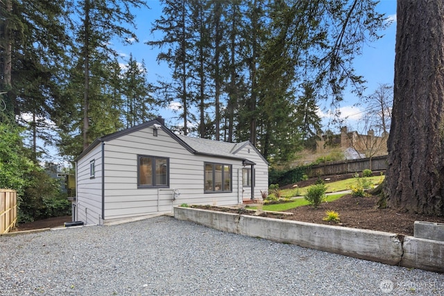 view of front of house featuring fence