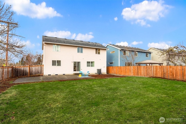 rear view of property with a patio, a yard, a fenced backyard, and central air condition unit