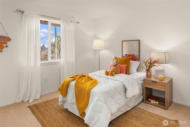 bedroom featuring carpet and baseboards