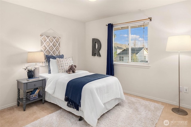 carpeted bedroom with baseboards