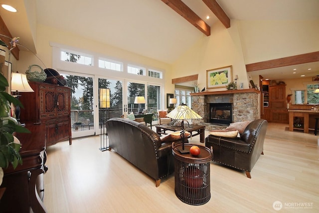 living room with high vaulted ceiling, recessed lighting, a stone fireplace, beamed ceiling, and light wood-type flooring