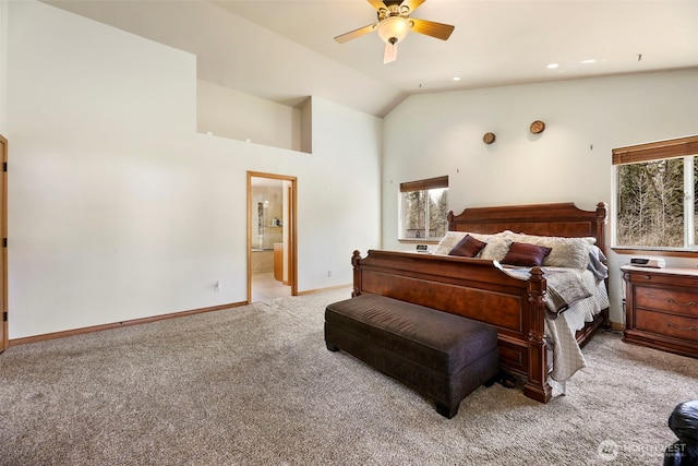 bedroom featuring ensuite bathroom, high vaulted ceiling, recessed lighting, light carpet, and baseboards