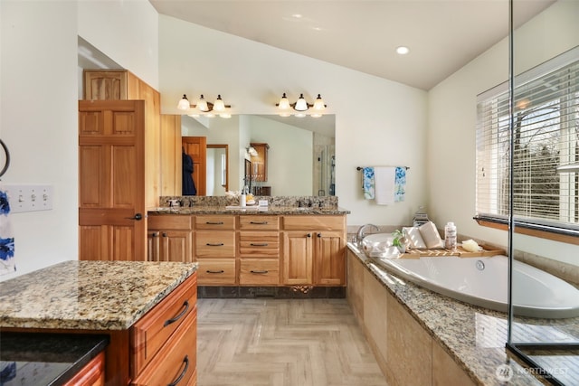 full bath featuring recessed lighting, a garden tub, a shower stall, and vanity