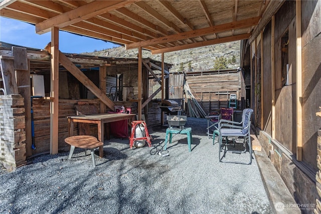 view of patio / terrace featuring an outbuilding