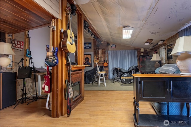 interior space featuring vaulted ceiling and wood finished floors