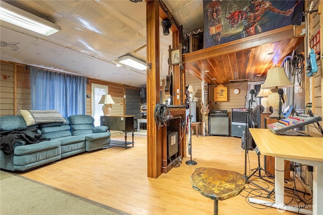 interior space with wood ceiling, wood walls, and wood finished floors