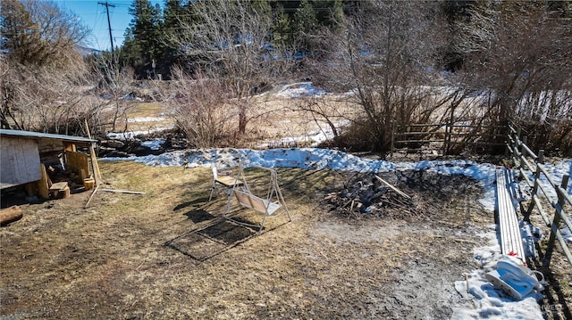 view of yard layered in snow