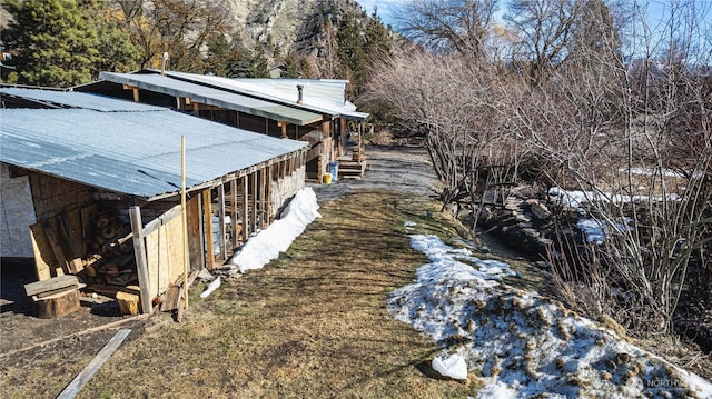 view of property exterior featuring metal roof