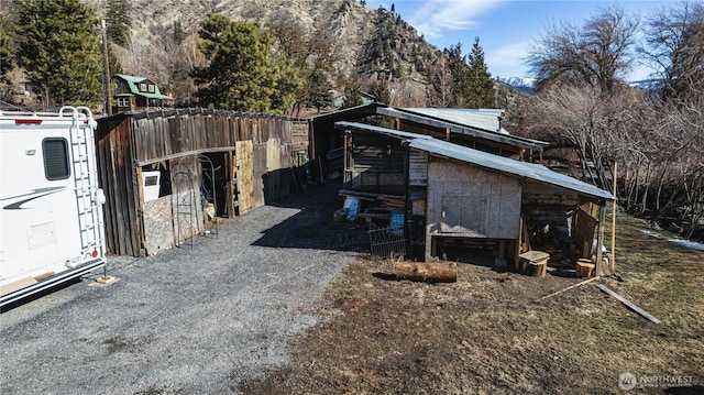 view of side of property with an outbuilding