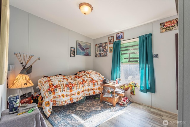 bedroom featuring wood finished floors