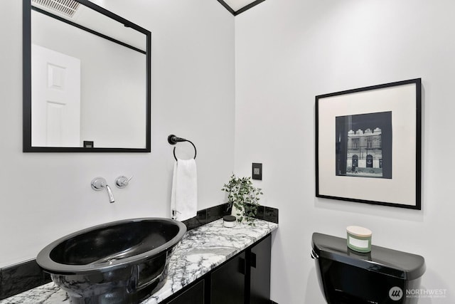 bathroom with visible vents and vanity