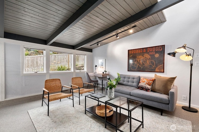 living area with baseboards, vaulted ceiling with beams, rail lighting, wood ceiling, and carpet flooring