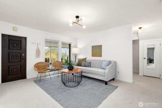 living room with carpet flooring, baseboards, and a chandelier