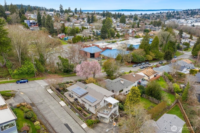 birds eye view of property with a residential view