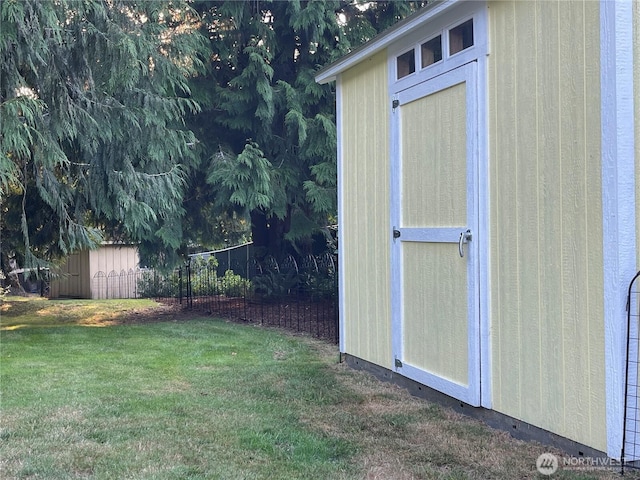 view of shed with fence