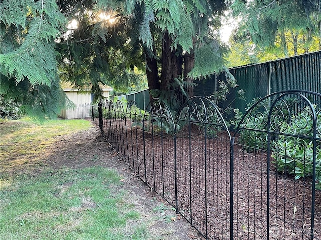 view of gate featuring fence