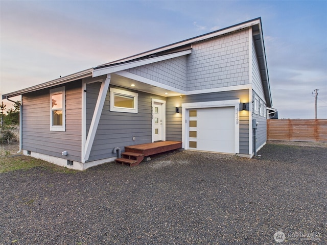 view of front of home featuring fence and driveway