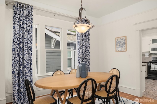 dining room featuring baseboards