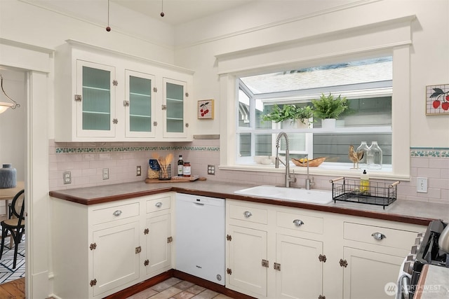 kitchen featuring a sink, plenty of natural light, dishwasher, and gas stove