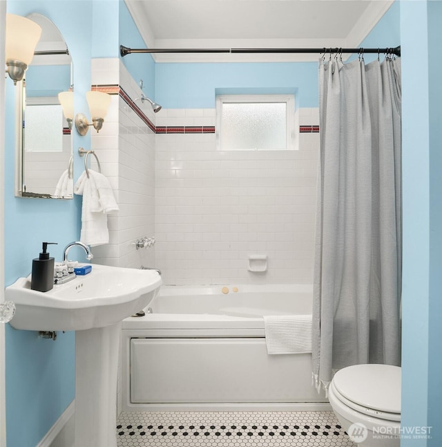 full bath featuring toilet, shower / tub combo, and tile patterned flooring