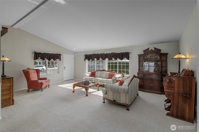 carpeted living room with baseboards and vaulted ceiling with beams