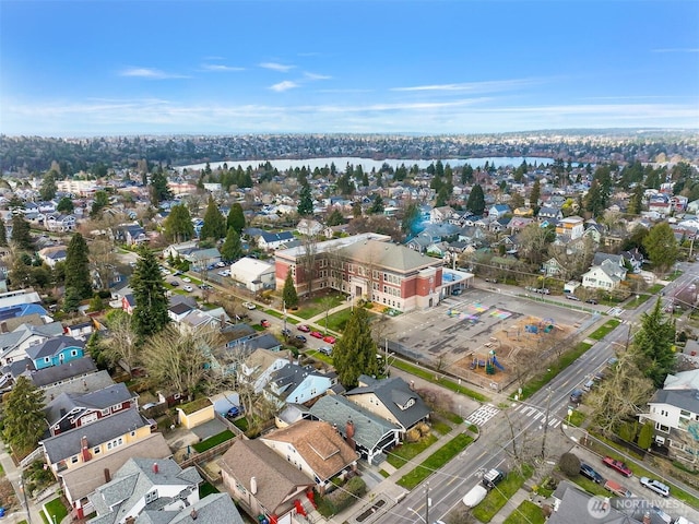 bird's eye view with a residential view and a water view