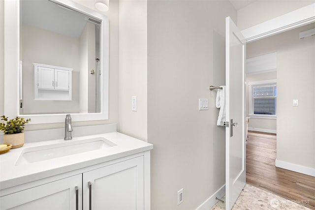 bathroom featuring vanity and baseboards