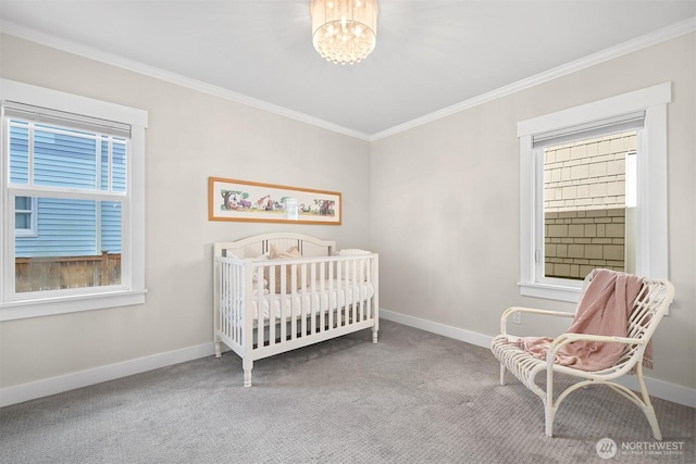 bedroom with baseboards, carpet, a chandelier, and crown molding