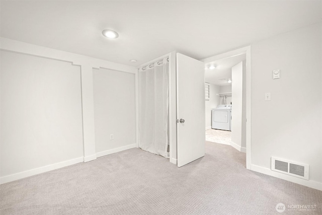 unfurnished bedroom with carpet floors, visible vents, and baseboards