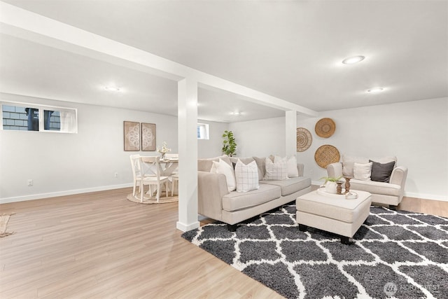 living area with recessed lighting, baseboards, and wood finished floors