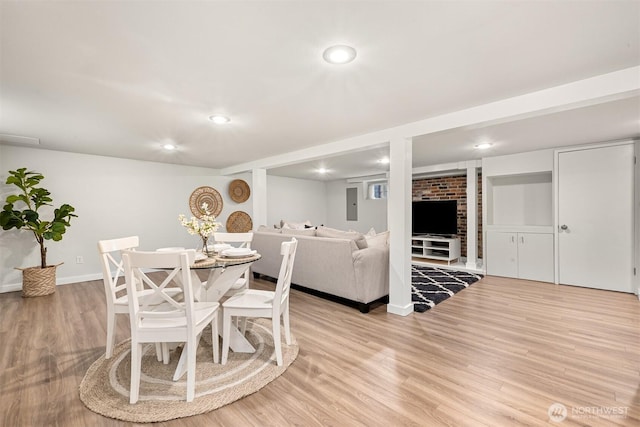 dining room featuring light wood-style floors, baseboards, and recessed lighting