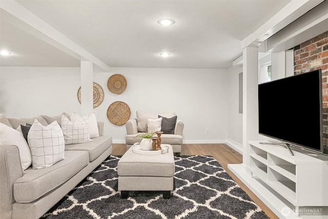 living area featuring recessed lighting, baseboards, and wood finished floors